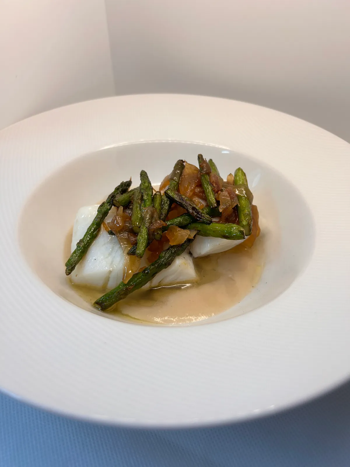 Cod with wild asparagus and bean cream, traditional cooking in El Born
