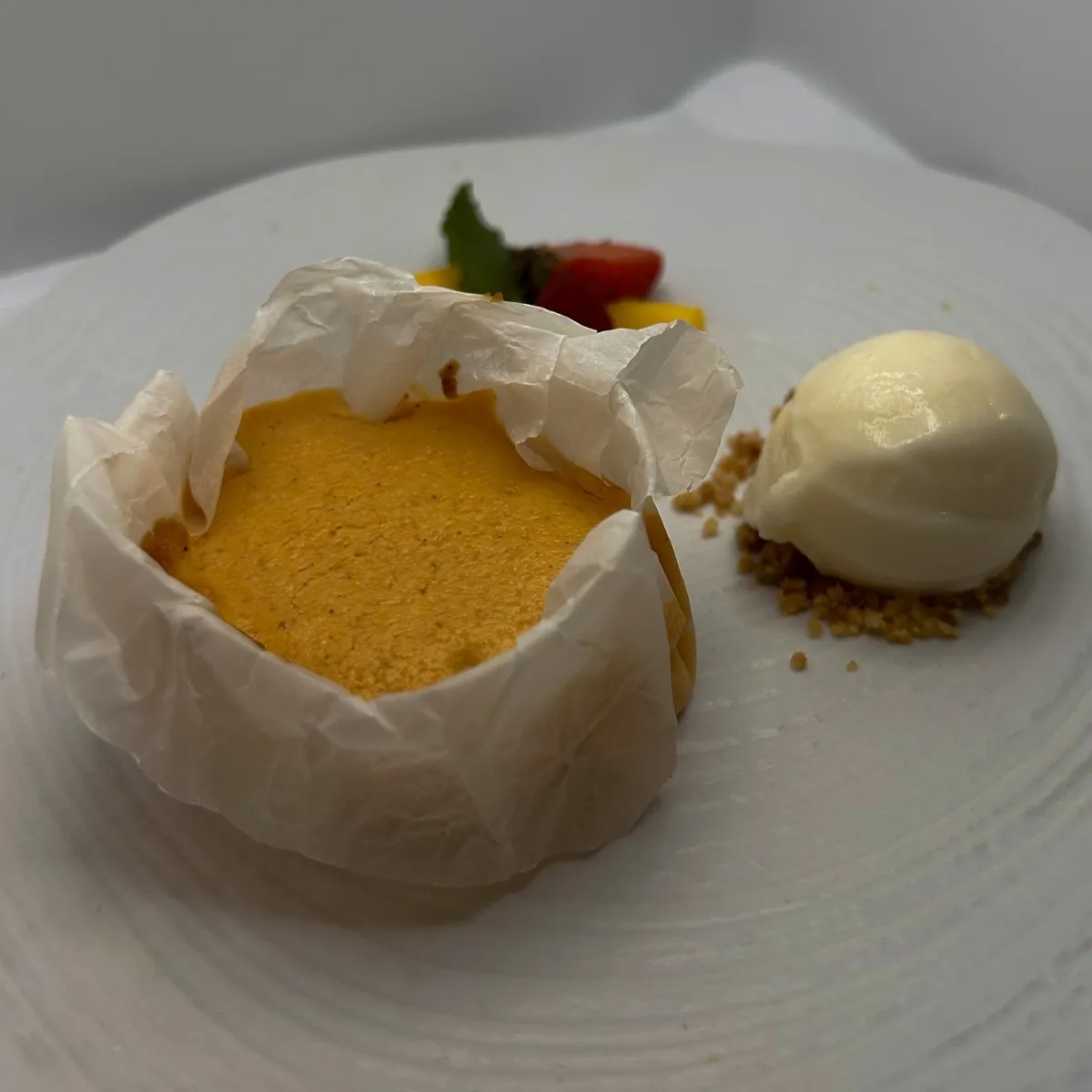 Sponge cake baked in paper with ice cream, a homemade dessert at La Estrella 1924