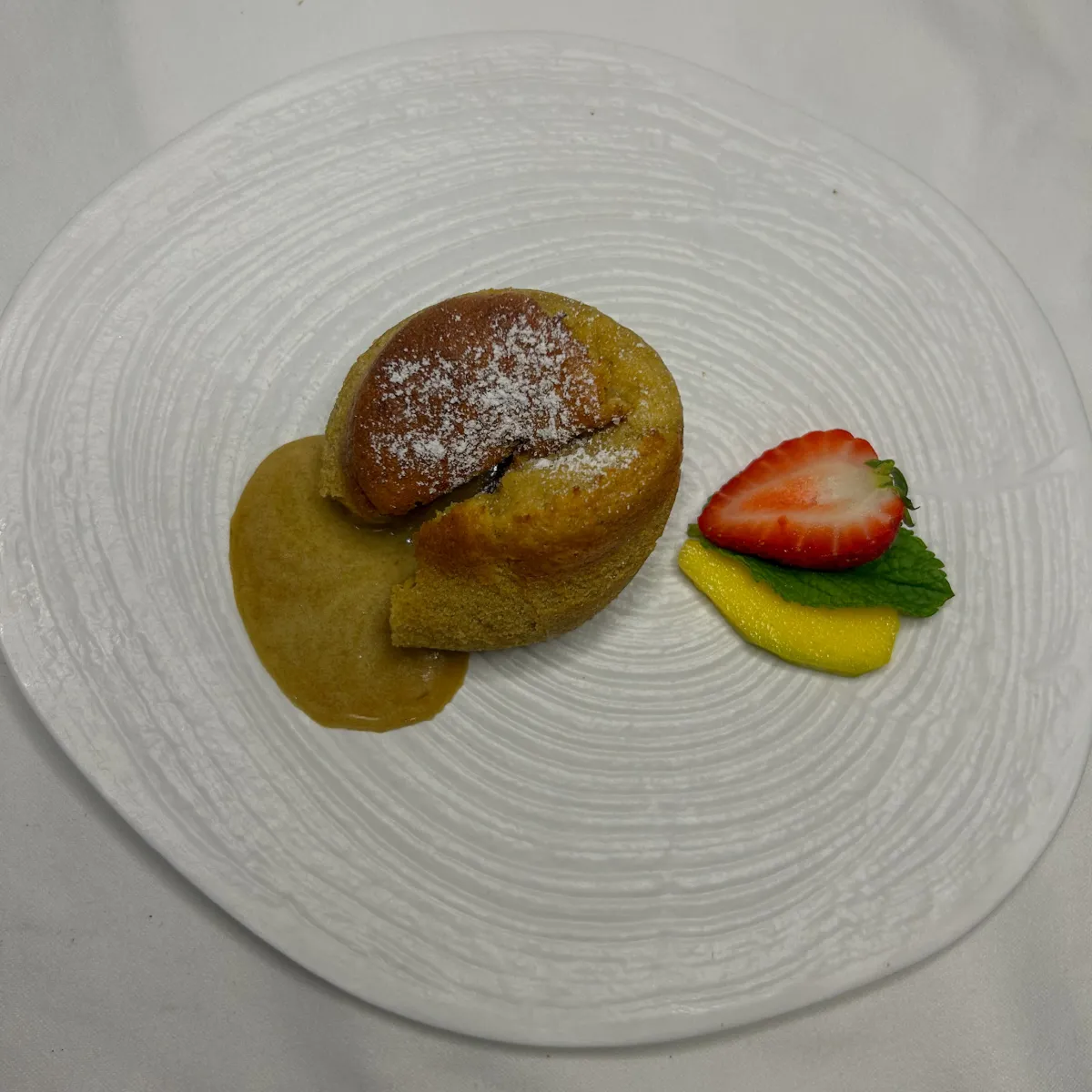 Homemade fondant-soufflé with strawberry and mango