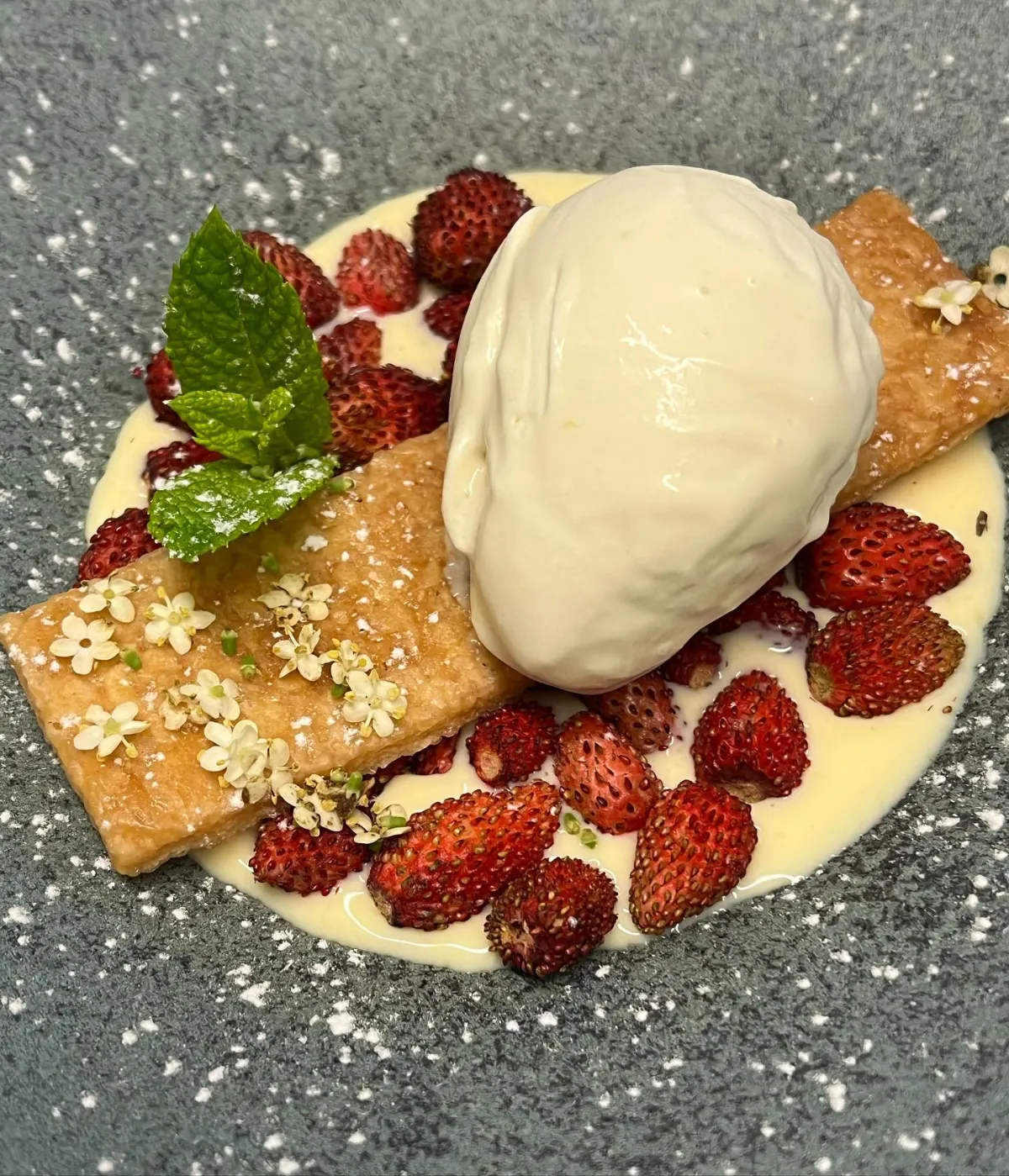 Wild strawberries with cream and ice cream, a dessert at La Estrella 1924