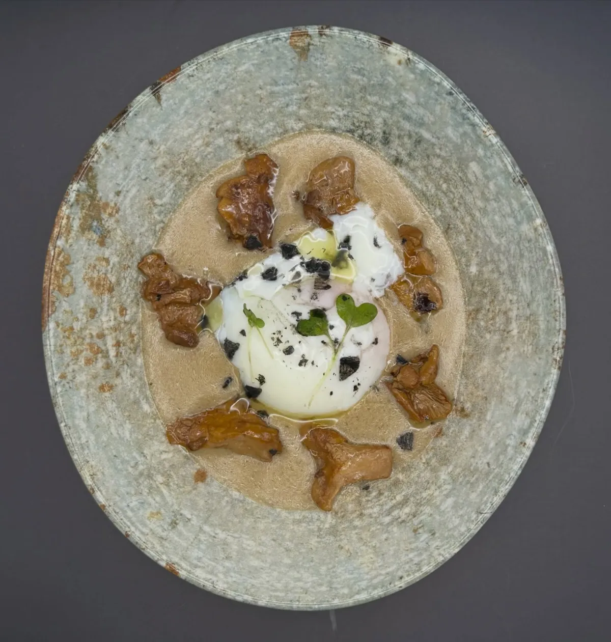 Slow-cooked egg with chanterelles and mushroom cream at La Estrella 1924