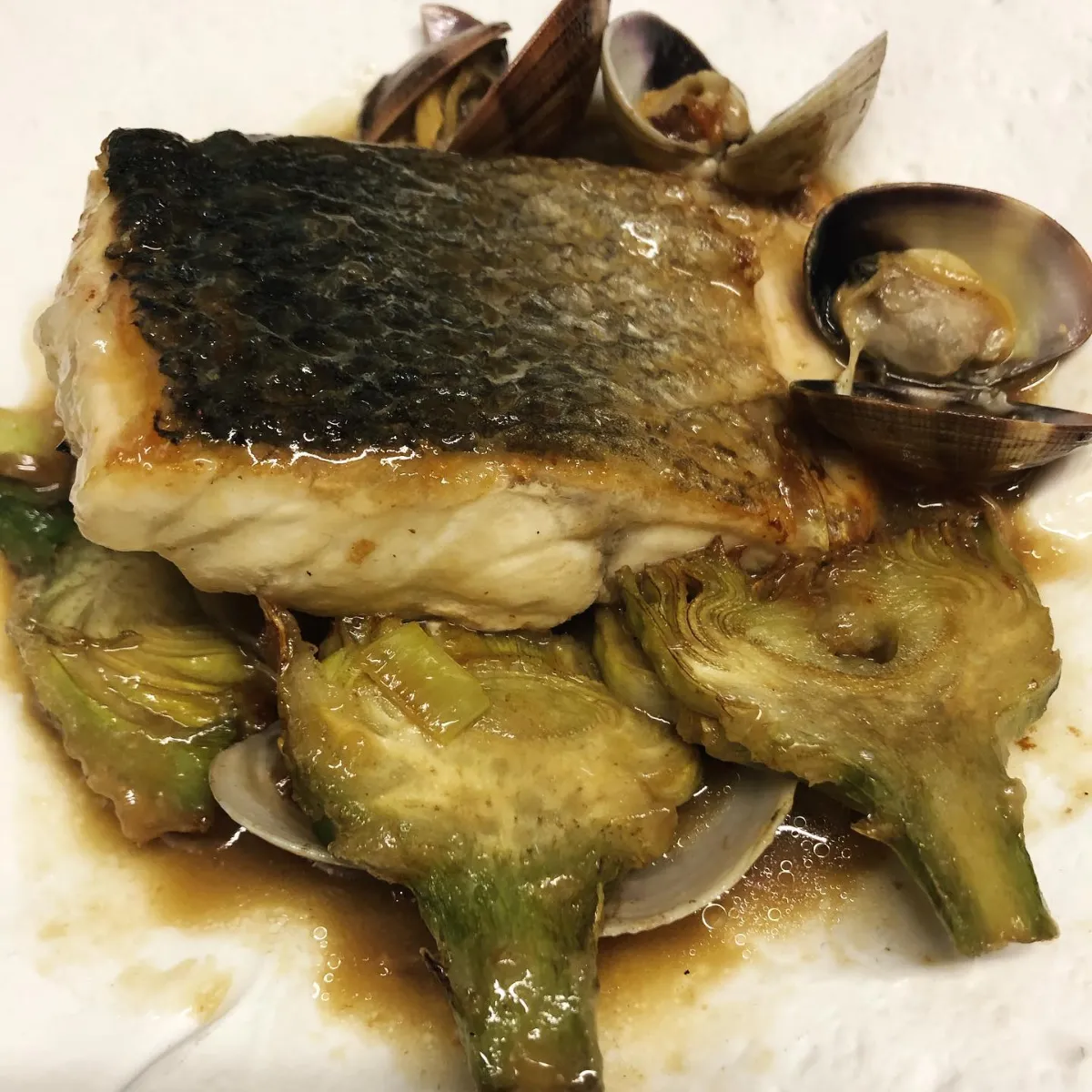 Grilled sea bass with artichokes and clams at La Estrella 1924