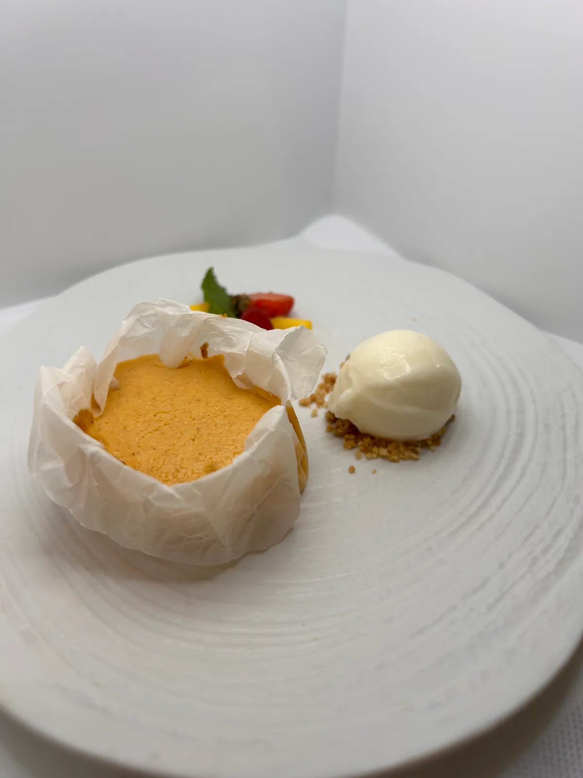 Homemade cake baked in paper with a scoop of ice cream